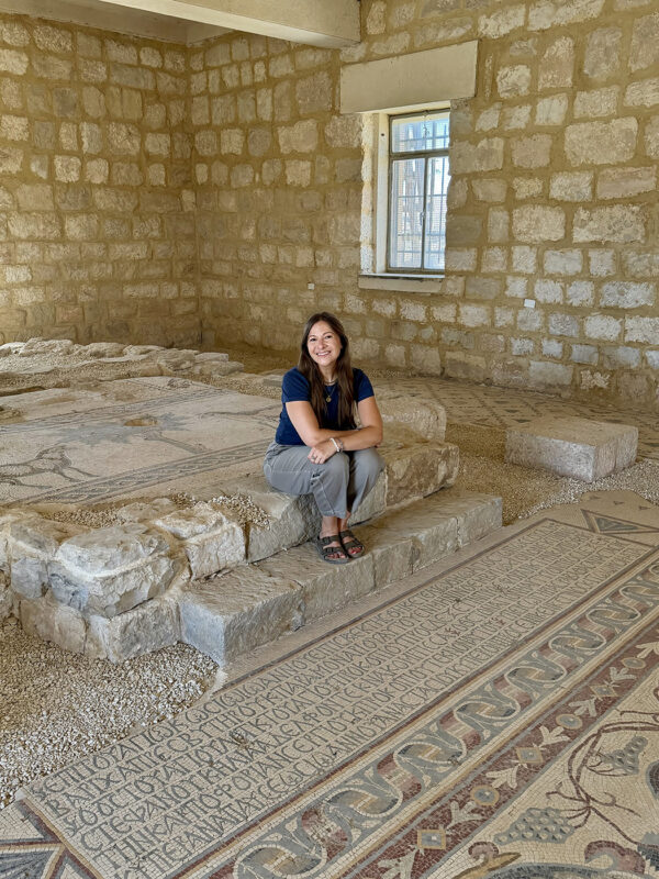 Kristen Flake on the raised bema, Church of Sts. Lot and Procopius, Khirbet al-Mukhayyat. (Photo by Mashoor Fshaikat.)