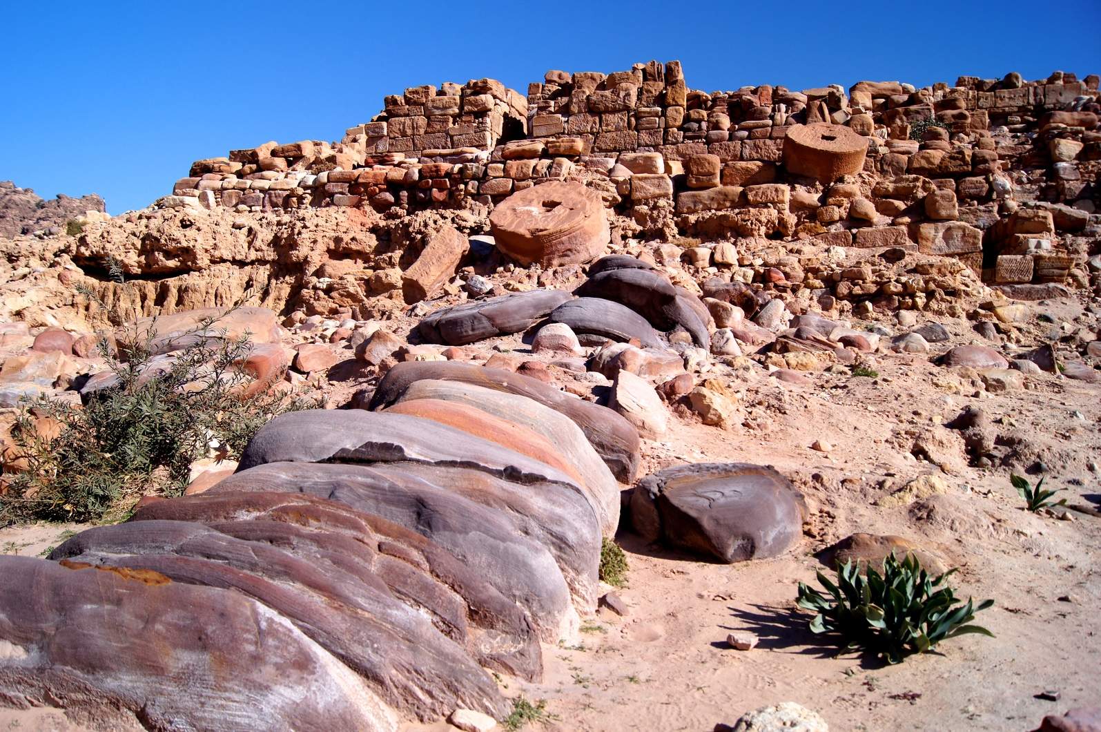 During their site visit, Gregory and Thomas learned about the Temple of the Winged Lions from project co-director Elena Ronza, who explained many of the site’s interesting features, including these enormous collapsed drums from two giant columns that once guarded the temple’s entrance. Photo by Thomas Harr.