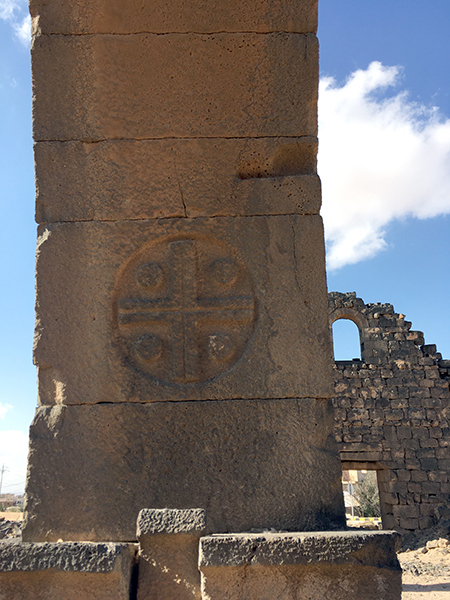 "Umm al-Jimal cross" on an arch pier of the Western Church, January 2020